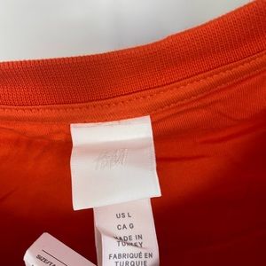 Large orange graphic sweatshirt